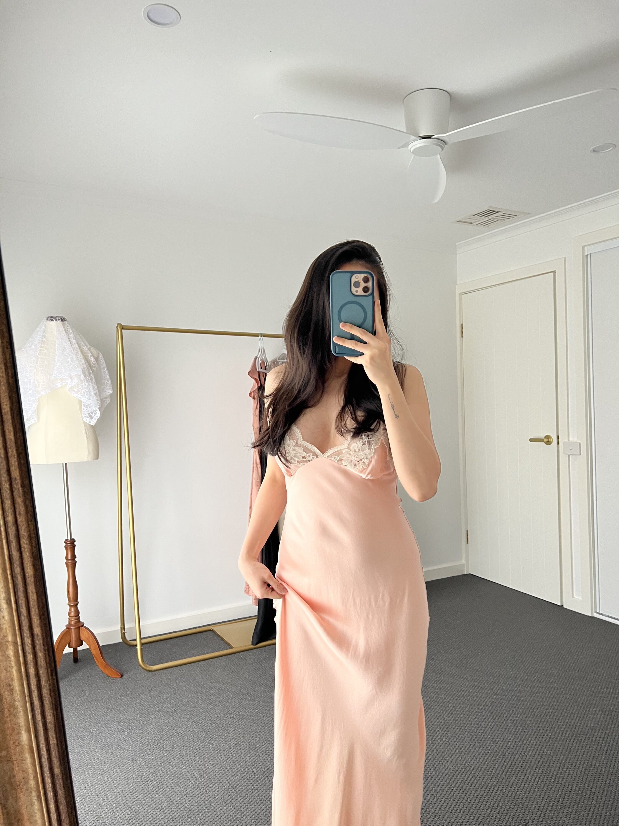 The gown in window light, showing the lace bodice