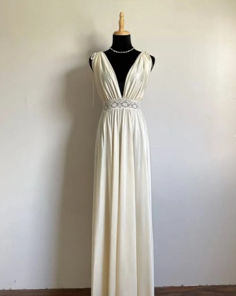 Ivory Grecian nightgown with a lace waist, on a dress form